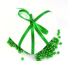 Image showing White heart with green beads