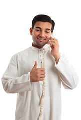 Image showing Happy ethnic businessman on phone