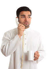 Image showing Business dilemma - worried man on phone
