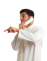 Image showing Ethnic businessman on phone pointing