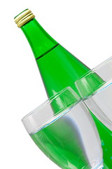 Image showing green bottle and glass of water