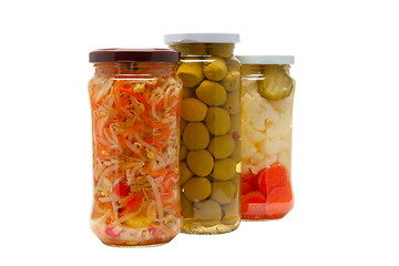 Image showing Glass jars with marinated vegetables  isolated on the white back