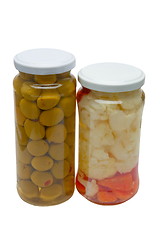Image showing Glass jars with marinated vegetables  isolated on the white back