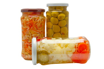 Image showing Glass jars with marinated vegetables  isolated on the white back