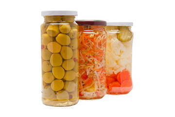Image showing Glass jars with marinated vegetables  isolated on the white back