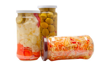 Image showing Glass jars with marinated vegetables  isolated on the white back