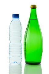 Image showing Bottles  of mineral water reflected on white background