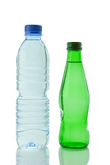 Image showing Bottles  of mineral water reflected on white background