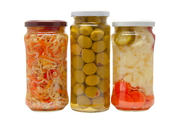 Image showing Glass jars with marinated vegetables  isolated on the white back