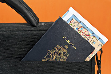 Image showing Canadian passport and map.