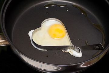 Image showing Fried egg in iron form heart