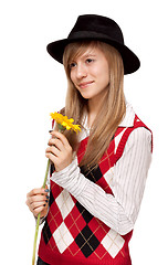 Image showing Girl with flower in black hat