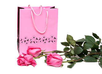 Image showing Rose gift package and three roses