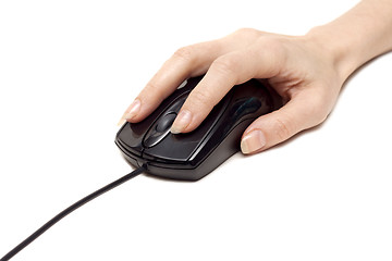 Image showing Feminine hand keeps computer mouse