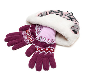 Image showing Winter hat with fur and violet gloves