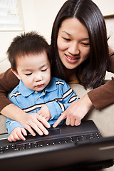 Image showing Mother and son with laptop