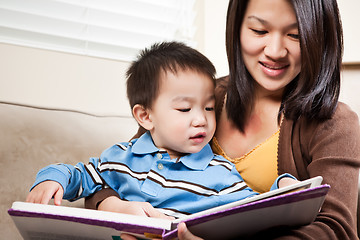 Image showing Mother and son reading