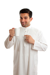 Image showing Smiling ethnic arab man with coffee