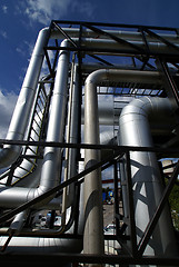 Image showing  industrial pipelines and cables against blue sky