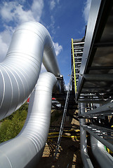 Image showing industrial pipelines and cables against blue sky