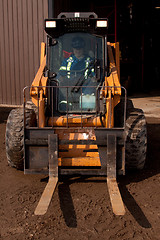 Image showing Woman driving Forklift