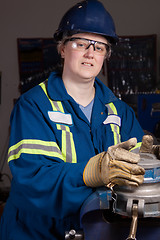 Image showing Woman in male type job