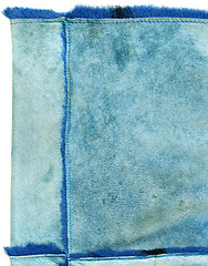 Image showing light blue chamois with fur edge. Good for background.