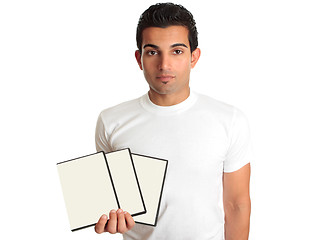 Image showing Man holding set DVD movies or games in his hand