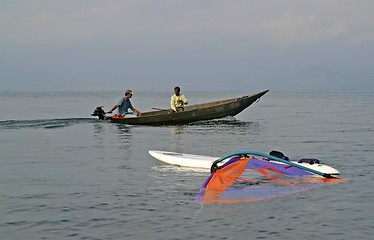 Image showing traditional fishing boat and windsurfer