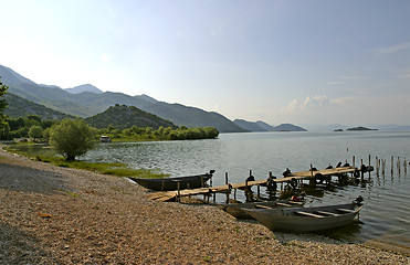 Image showing old fishing boats on lake Skarda