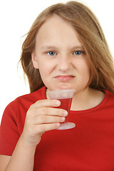 Image showing young girl taking medicine