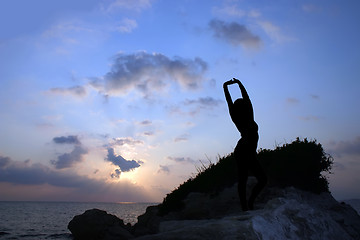 Image showing Silhouette of a girl against the sunset