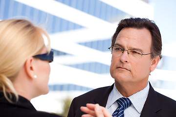 Image showing Businessman Listens to Female Colleague