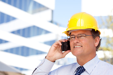 Image showing Contractor in Hardhat and Necktie Talks on His Cell Phone