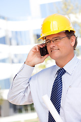 Image showing Contractor in Hardhat and Necktie Talks on His Cell Phone