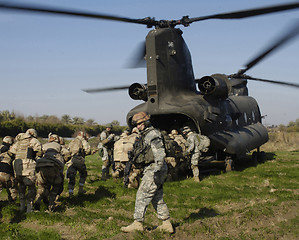 Image showing Soldier boarding helicopter