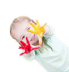 Image showing Little girl playing with colors