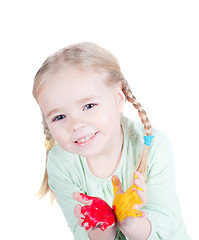 Image showing Little girl playing with colors