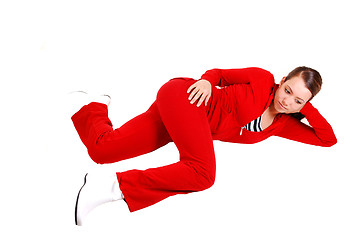 Image showing Girl lying on floor and relaxing. 