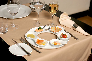 Image showing Starter or Entree of a french dish with fish, seafood mixed and foie gras