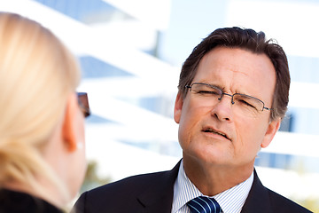 Image showing Businessman Talking with Female Colleague