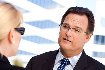 Image showing Businessman Talking with Female Colleague