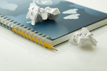 Image showing crumpled papers and notebook