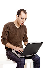 Image showing Working with a laptop