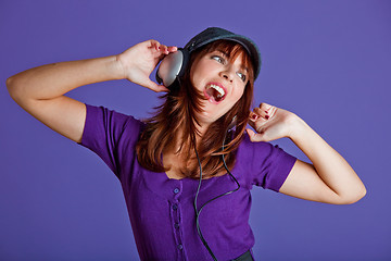 Image showing Beautiful woman listening music