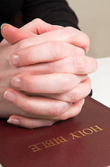 Image showing Praying Hands On Bible