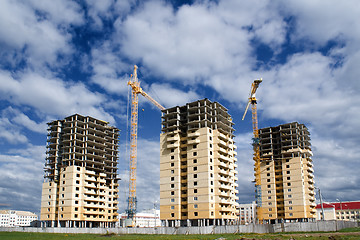 Image showing Construction of three buildings