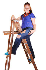 Image showing Pretty girl on the stepladder.