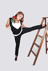 Image showing Pretty girl on the stepladder.