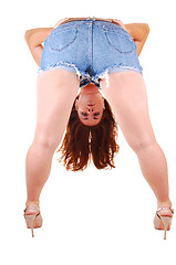 Image showing Pretty girl in jeans mini skirt.